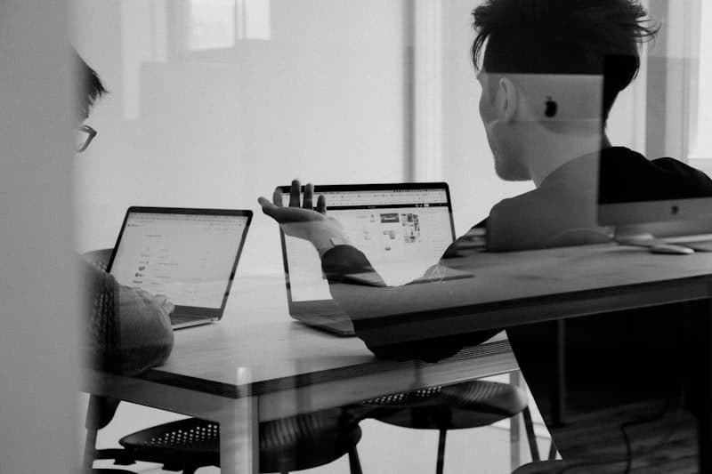 Business team collaborating around a desk to review funding options
